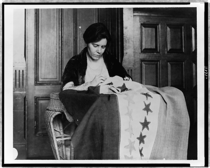 Photo from http://loc.gov. Alice Paul sewing the suffragette flag, sometime between 1912 and 1920. 