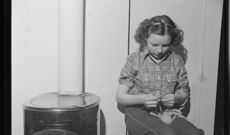 Photo from http://loc.gov: Moreno Valley, Colfax County, New Mexico. A rancher's daughter knitting during a poker party at George Turner's ranch. (Minus the stove, this is pretty much what I looked like on my couch.)