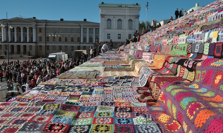 Just some of the 7,800 crochet quilts laid on the steps of the Helsinki Cathedral by Flickr user timelessriver.