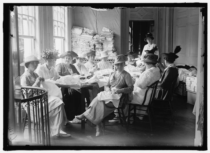 Photo from http://loc.gov, by Harris & Ewing in 1915.  Senate Women Sewing at District Headquarters, Red Cross